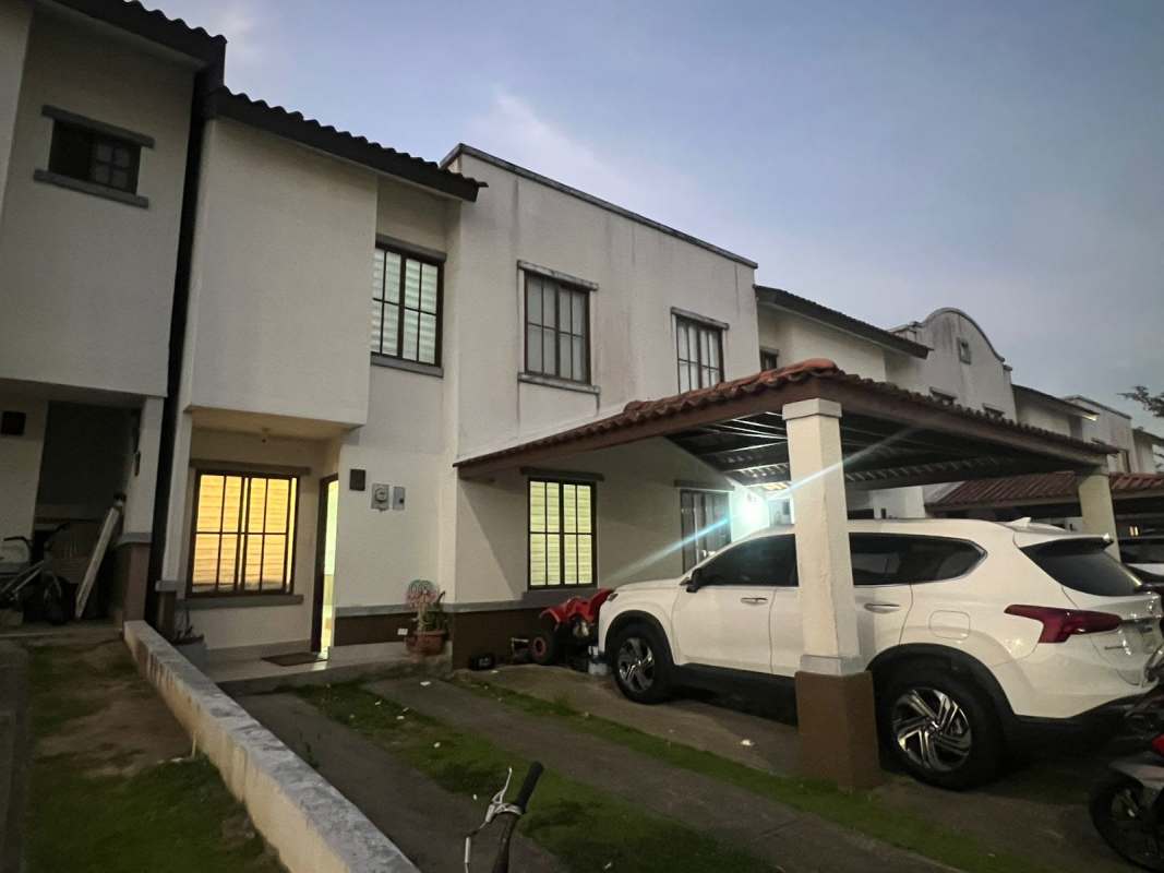 Contemporary living room with green sofa, coffee table and tiled floor in Villa Zaita rental home