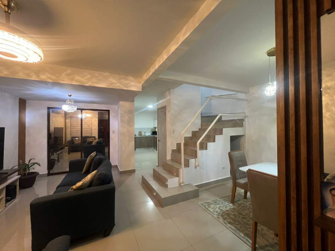 Bedroom with white walls and wardrobe in townhouse at Villa Zaita Panama for rent