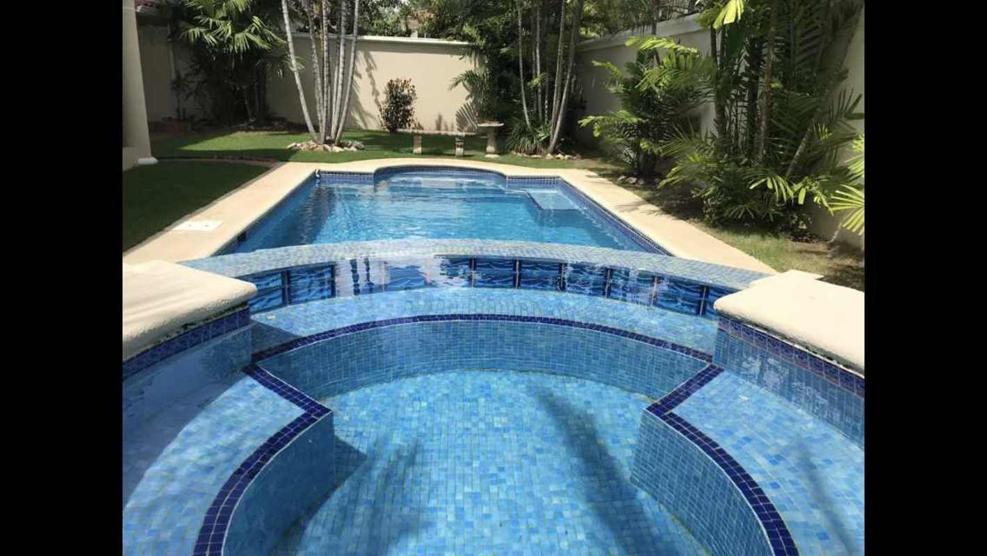 Empty bedroom with large window, AC, ceiling fan at Costa Azul house Costa del Este Panama