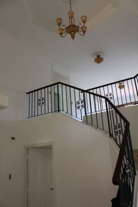 Large empty bedroom with AC, ceiling fan, window view Costa Azul house Panama