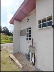 Spacious tiled living area with windows and open layout in Villas del Lago Emperador Arraiján Panama