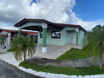 Entrance archway with palm trees of Brisas del Golf gated community Arraiján Panama