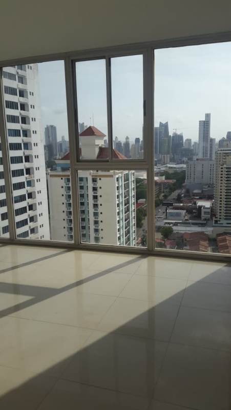 Modern bathroom with granite countertop and glass enclosed shower in PH Prive Tower Panama City