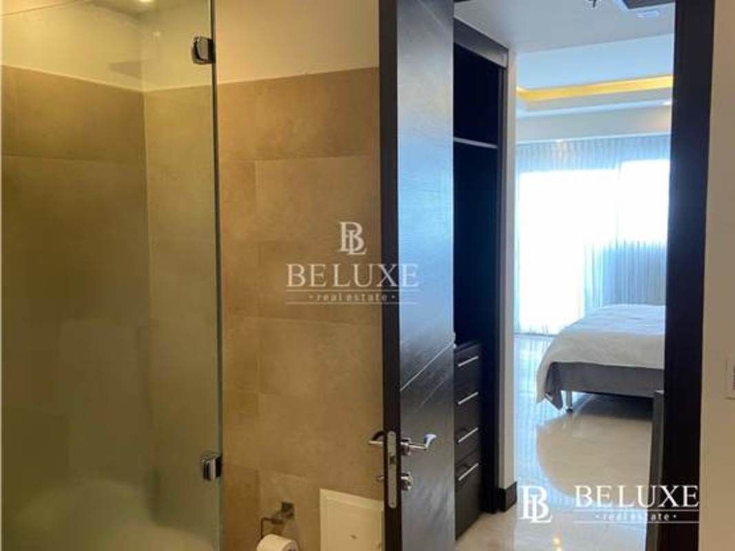 Modern bathroom with double granite sink vanity and glass shower PH TOC Punta Pacifica Panama