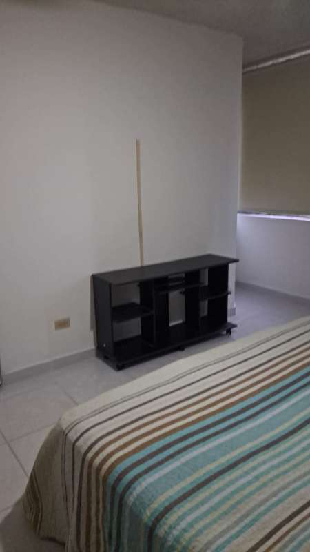 Compact apartment kitchen with gas stove and tile backsplash PH Ibiza Obarrio Panama
