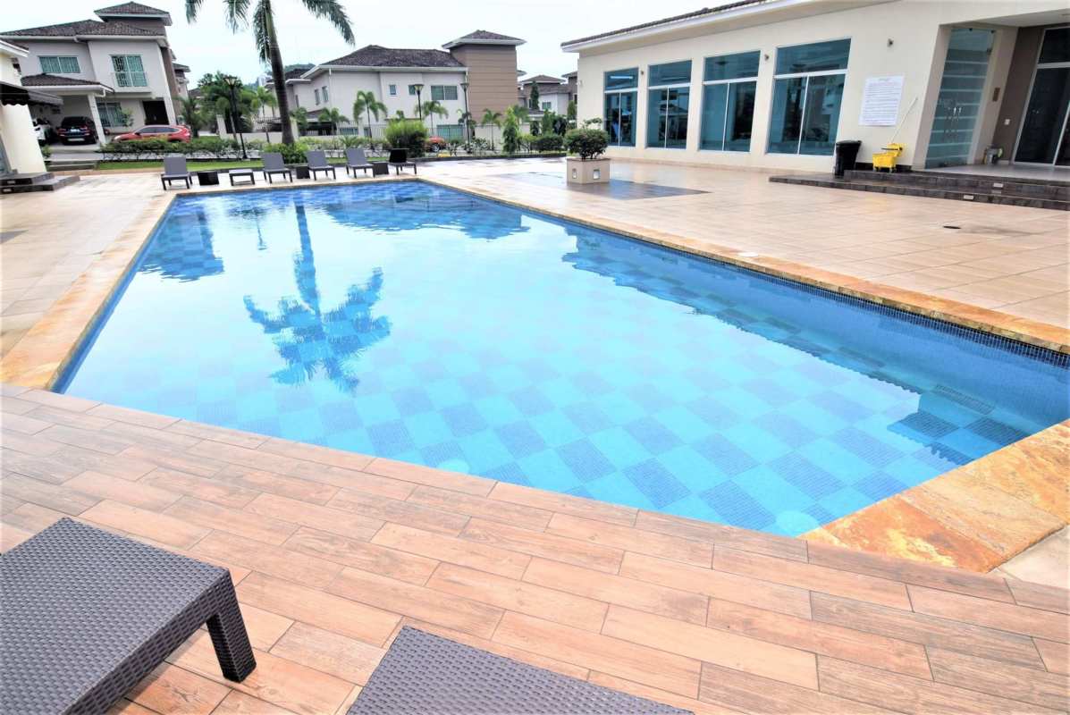 Children's playground equipment in family-friendly Dorado Village community Condado del Rey Panama