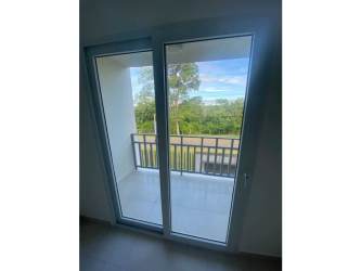 Bright master bedroom with large window built-in closet tile floor in La Chorrera Panama