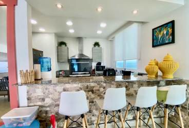 Contemporary living room open concept ocean view condo for sale Santa Clara Residences Panama beachfront property