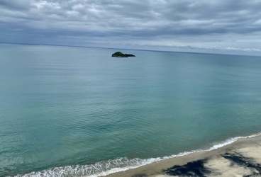 Tranquil white sand beach with turquoise waters Santa Clara Residences oceanfront condo location Panama