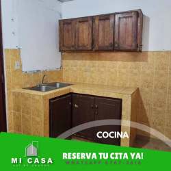 Compact kitchen with cabinets and tile backsplash rental house Penonomé Coclé