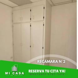 Bedroom with built-in wardrobe and white walls in Penonomé rental home