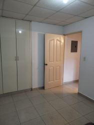 Spacious living room with modern sectional sofa, natural light and pendant lights PH Sausalito Gardens Costa Verde Panama