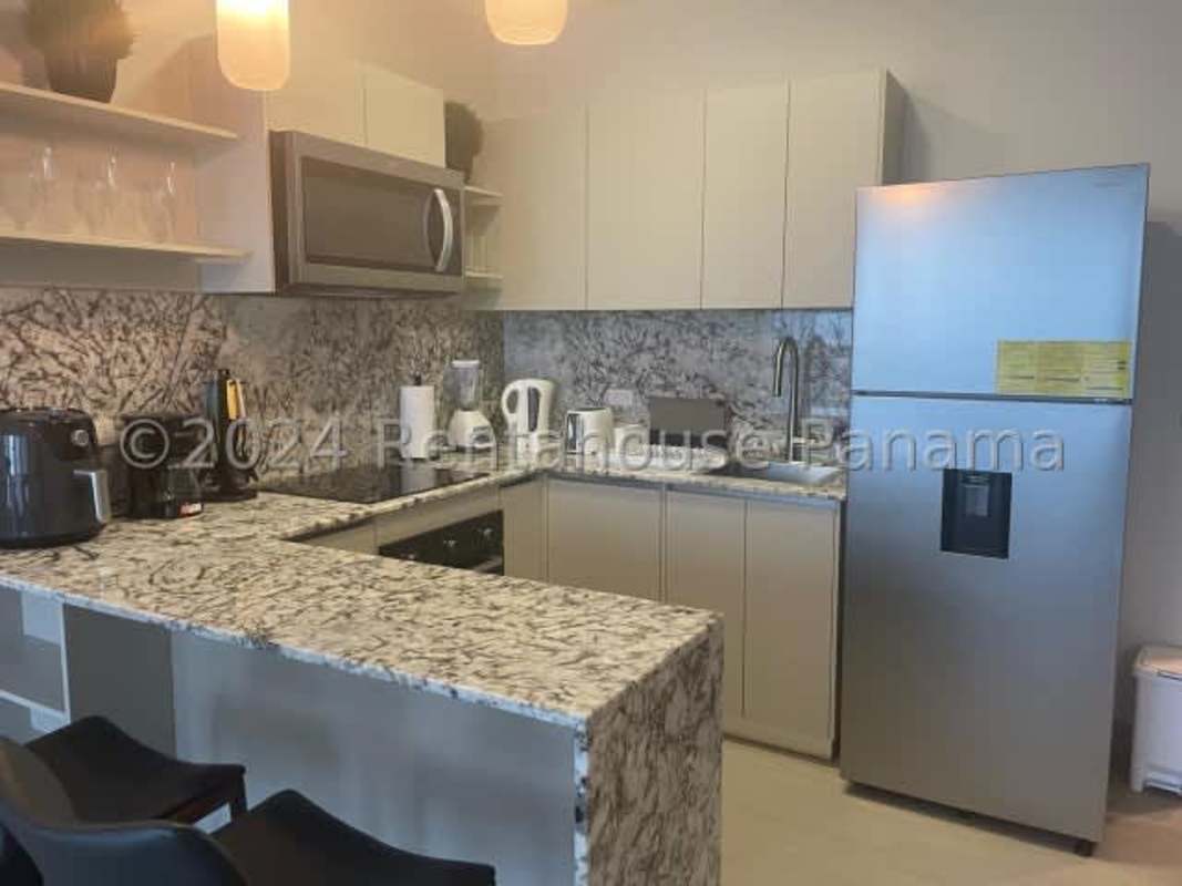 Kitchen with granite counters and stainless appliances PH Arcadia Costa del Este Panama