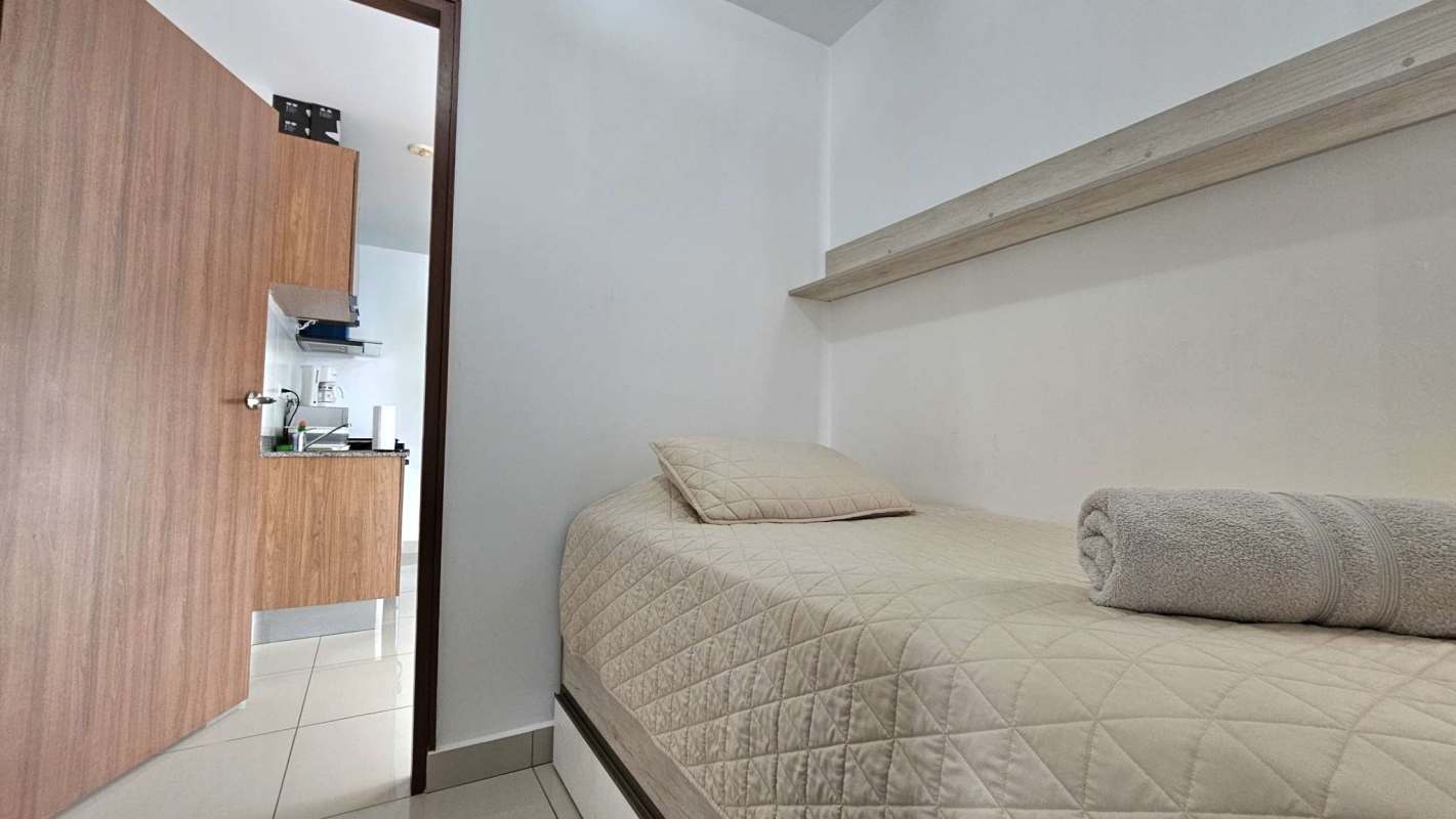 Bedroom with large window and skyline view PH Sky Point Obarrio Panama City