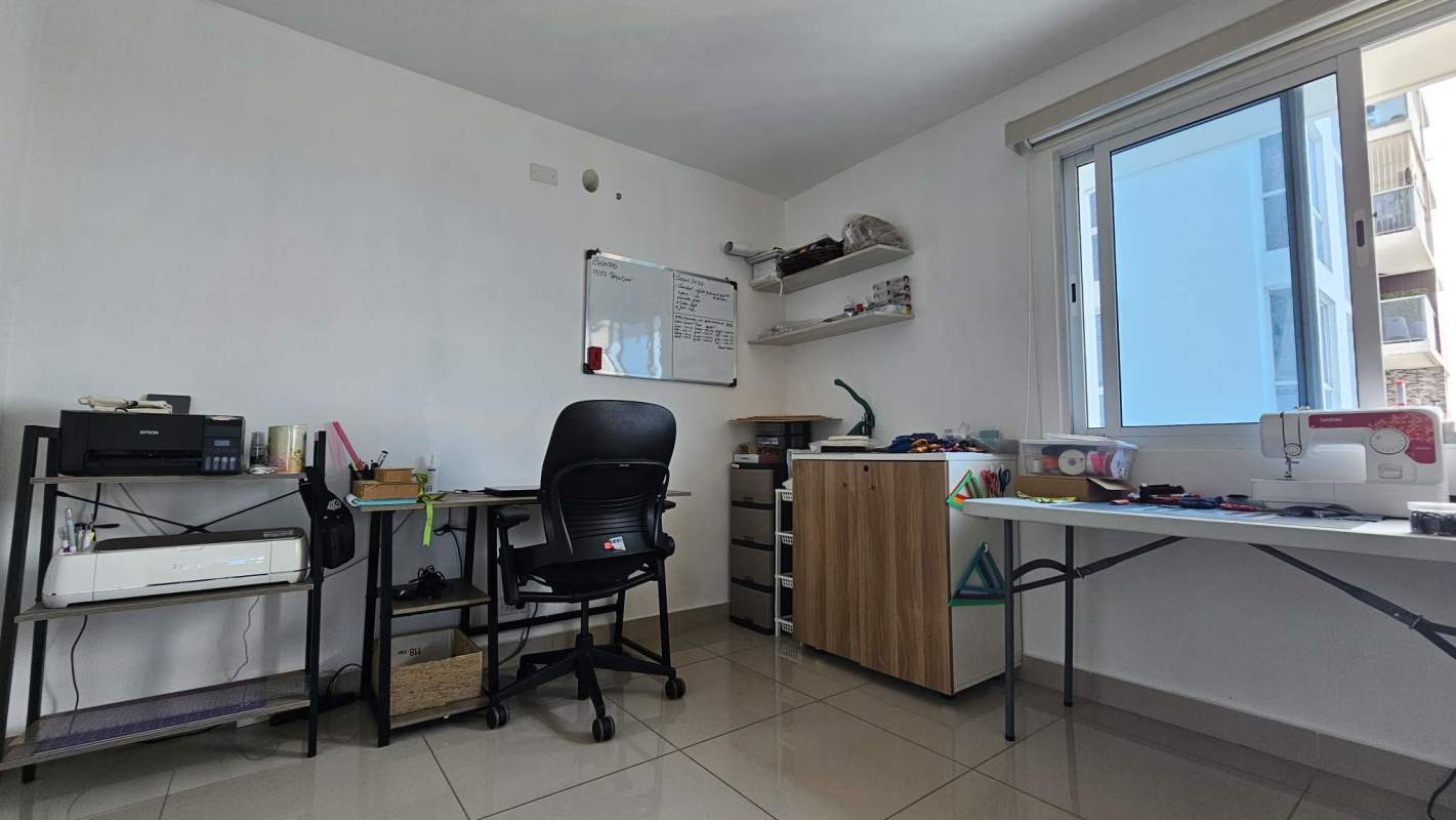 Open dining and living room with balcony access at PH Villa de las Fuentes Panama