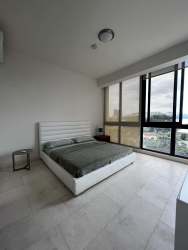 Modern double-height living room with ocean views in PH Mareas Beach Club penthouse Playa Coronado Panama