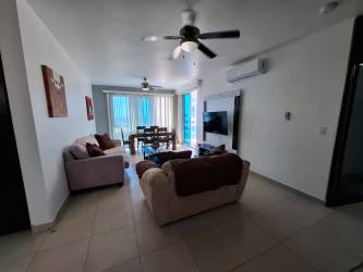 Bright living and dining area with terrace access in Playa Blanca penthouse for sale
