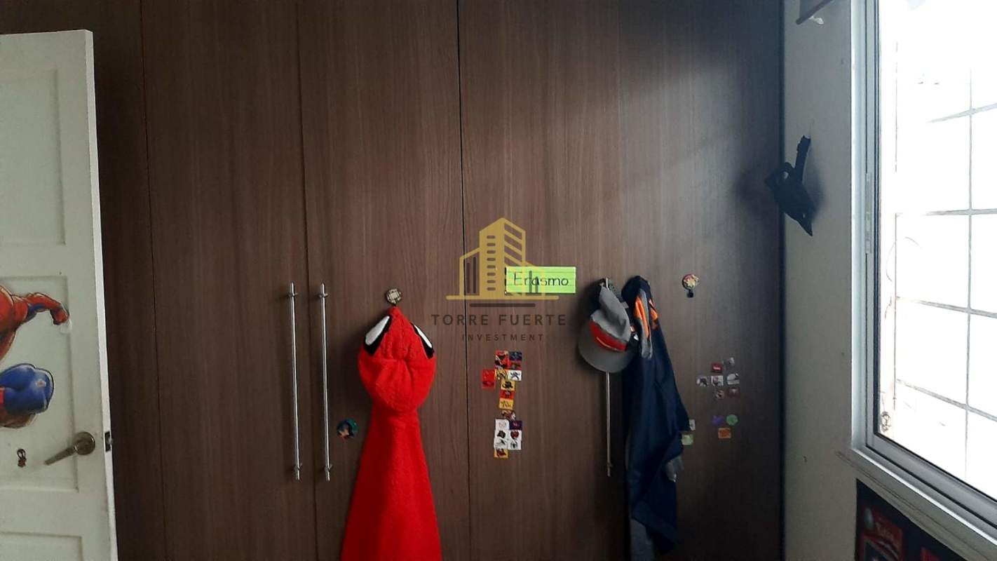 Dining area with glass sliding doors leading to garden and terrace at Villa Lucre house Panama