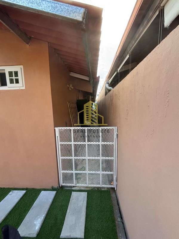 Kitchen with wood cabinets, granite countertop, and modern appliances in Villa Lucre Panama