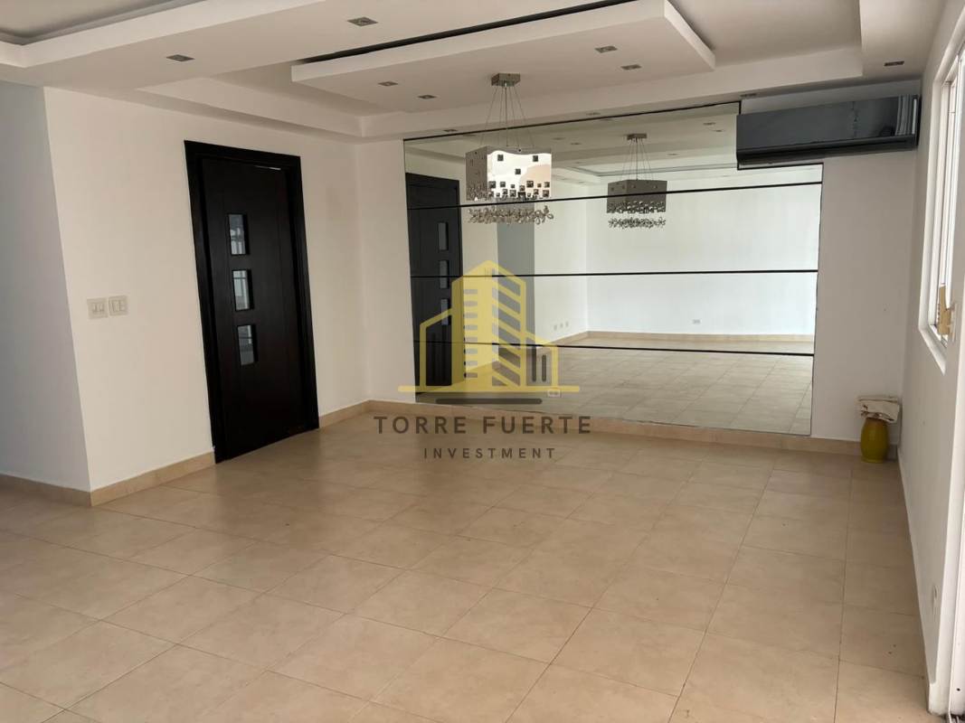 Elegant staircase with glass railing at Brisas del Golf Panama City modern house