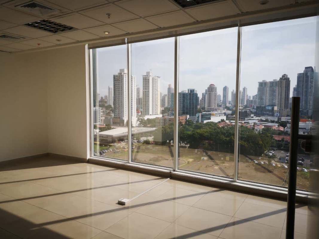 Modern office with glass partitions floor-to-ceiling windows PH BICSA Financial Center Panama