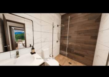 Modern bathroom with walk-in shower glass partition wood accent tiles Boquete condo