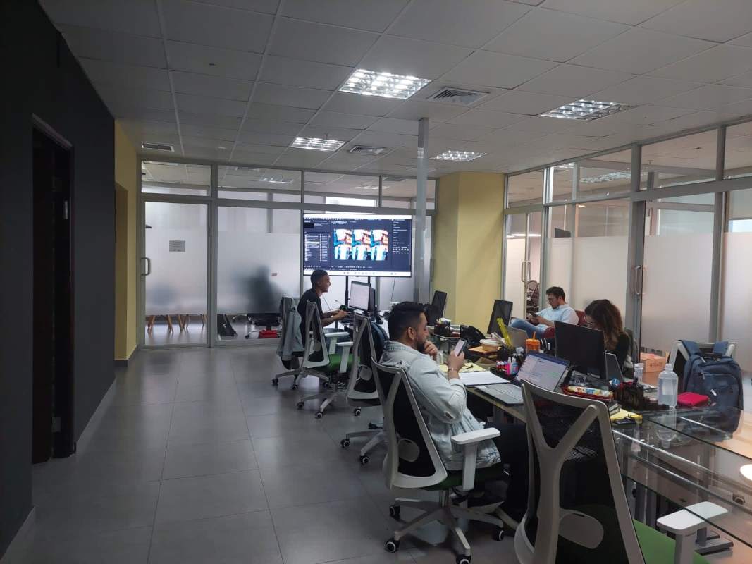 Executive office with floor-to-ceiling windows and modern glass furniture city view Panama