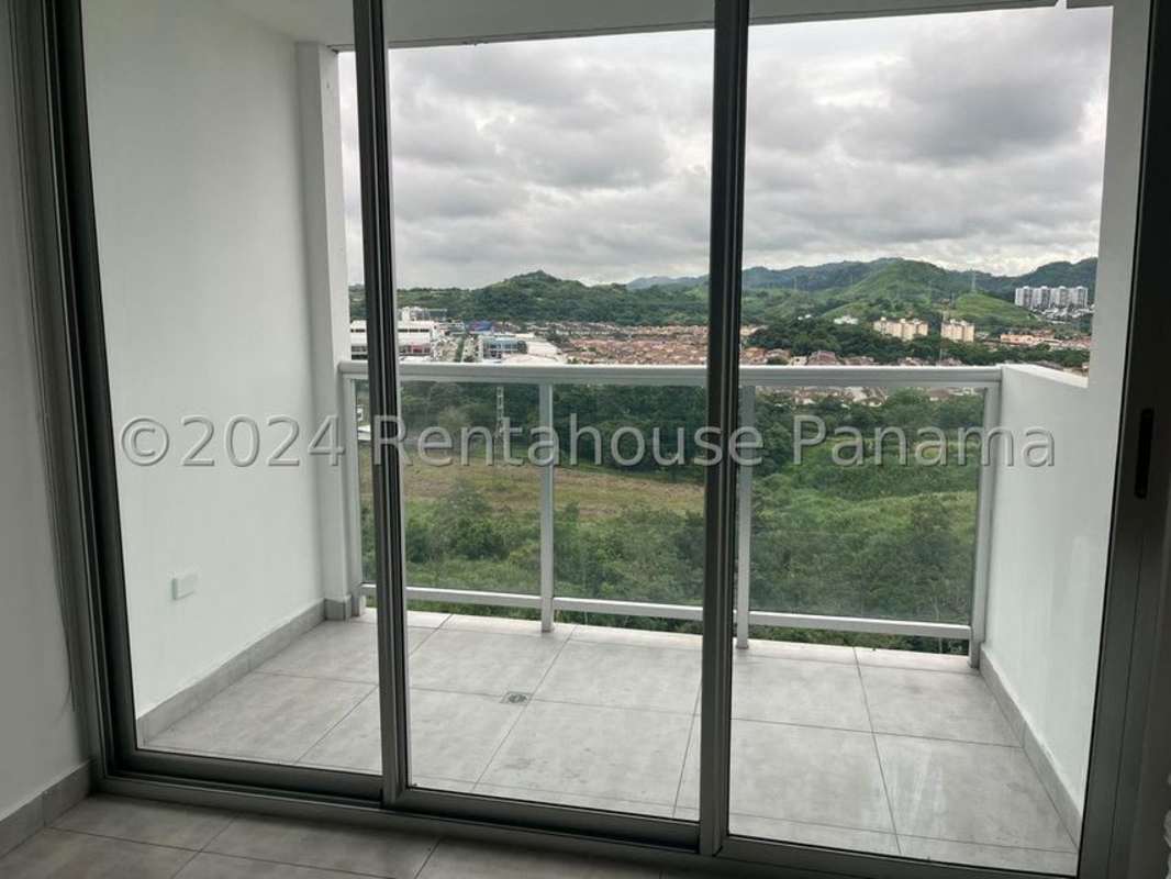 Balcony with panoramic city skyline and greenery views at PH Condado Gardens Panama