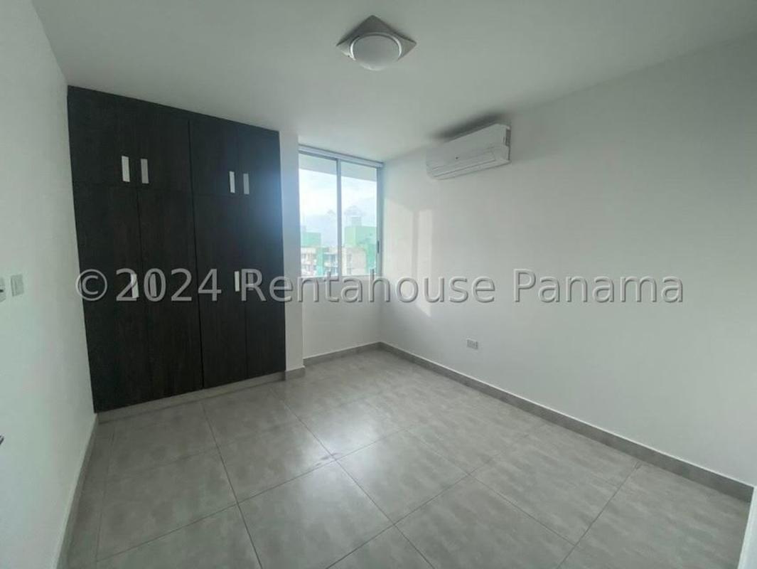 Living room with sliding glass doors to balcony, panoramic views in PH Condado Gardens Panama