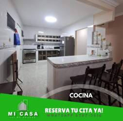 Dining room with chandelier next to traditional kitchen rental house Penonomé Coclé Panama