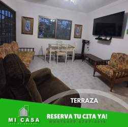 Living room with TV dining set sofa traditional decor rental house Penonomé Coclé Panama