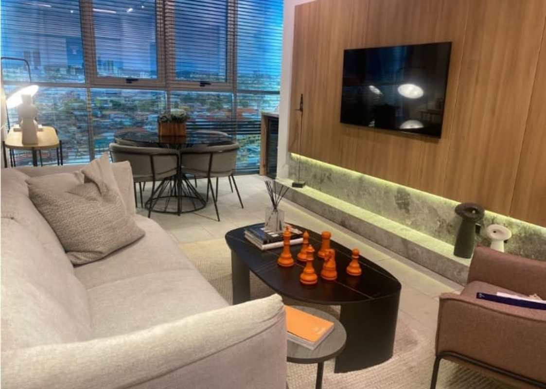 Living and dining area with large windows, wood accents PH Bloom Tower Panama