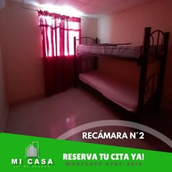 Compact kitchen with refrigerator, cabinets at Villa Karola Penonomé rental house