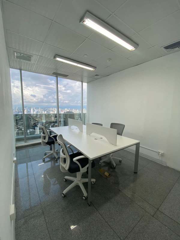 Open co-working space with glass separations high floor office rental F&F Tower Panama