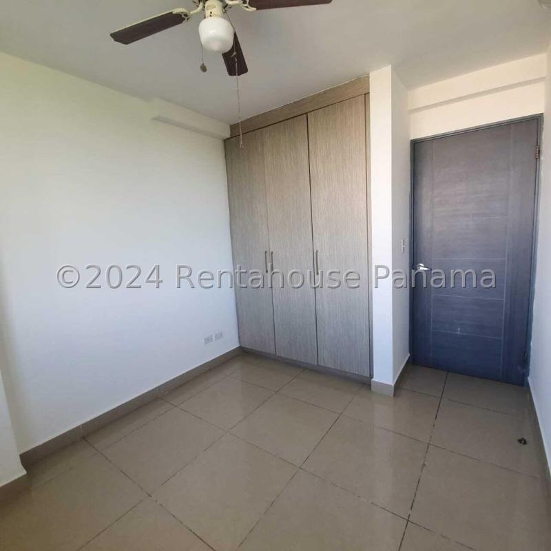 Modern gym room with treadmills, elliptical, and weights in Green Park Panama