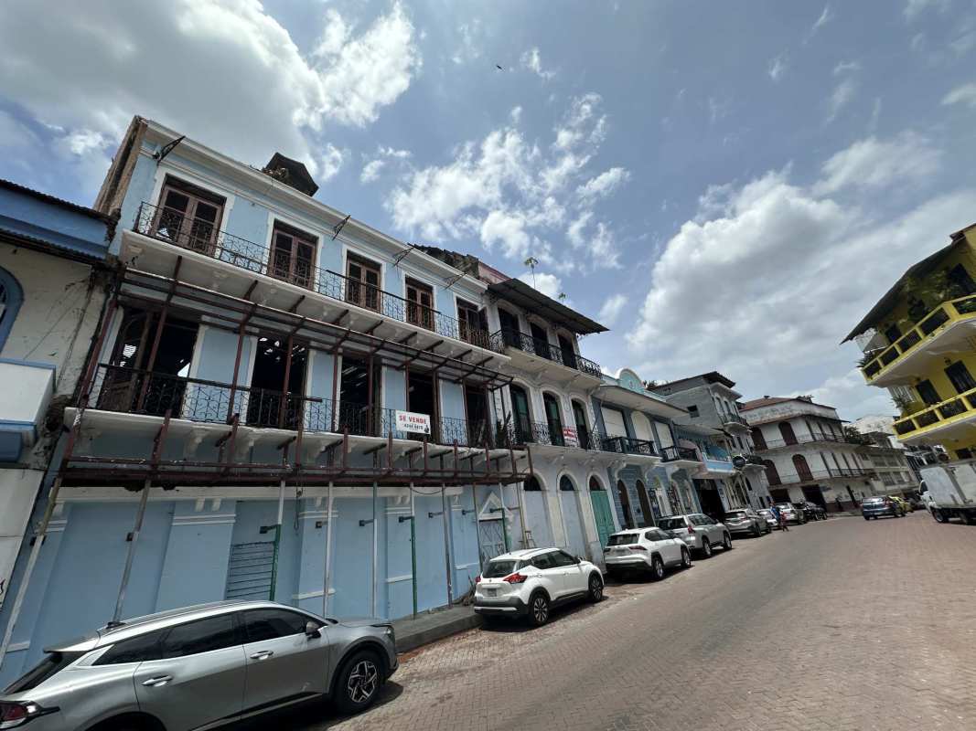 Balconies and arched windows on historic Casco Viejo Panama building for renovation