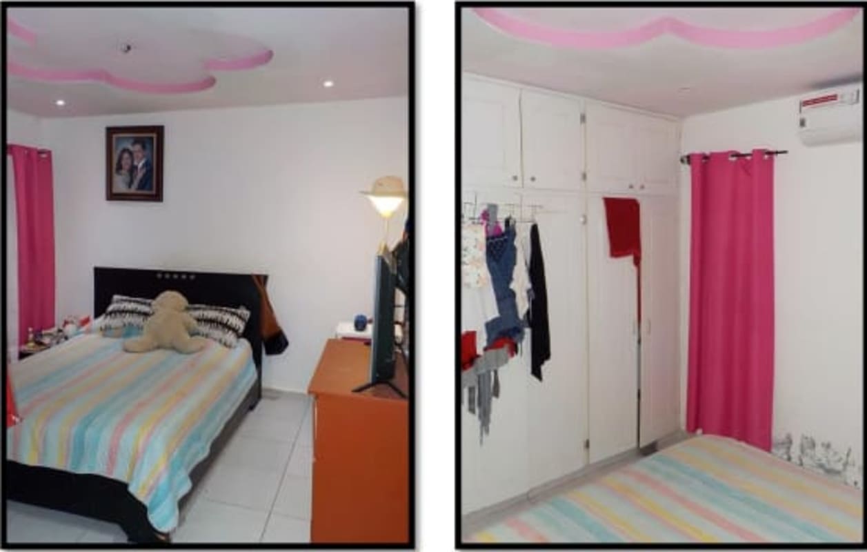 Bedroom with white closets, pink ceiling design and AC in Altos de La Castellana house Panama