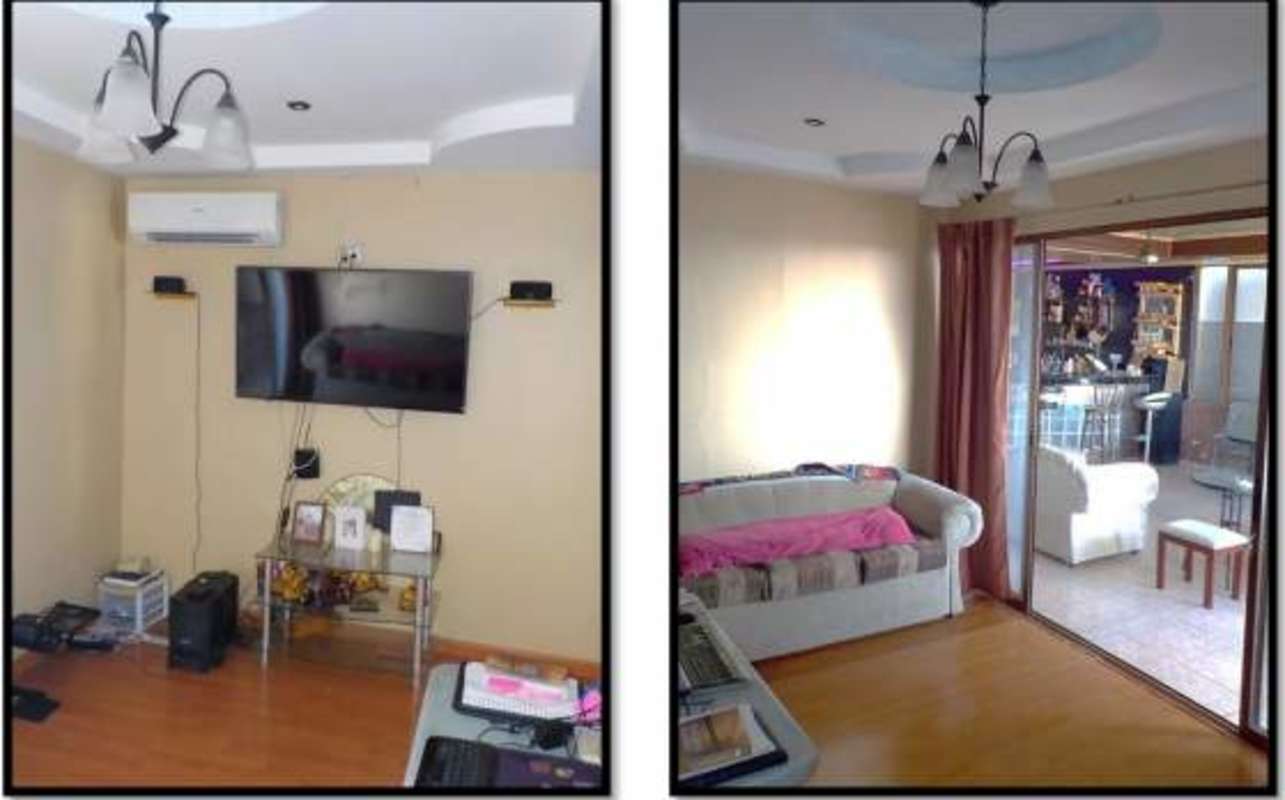 Colorful kids bedroom with pink curtains and striped bedcover in Panama City