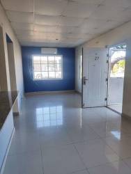 Kitchen area with countertop and open window view inside family home in Los Santos Panama