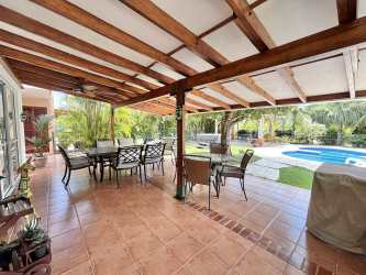 Open-plan living room with patio access Villas Decameron Golf Villa for sale Playa Blanca Panama