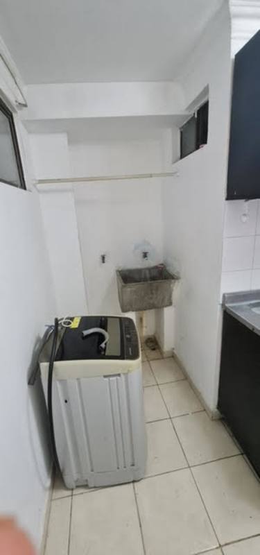 Compact laundry area with utility sink and washing machine space in Panama City Río Abajo apartment