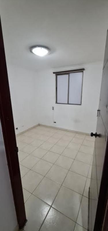 Small bedroom with tiled floor window and closet in affordable Río Abajo Panama apartment