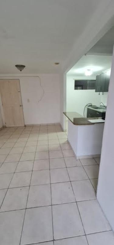 Affordable apartment bathroom with toilet sink and basic tile walls in Río Abajo Panama