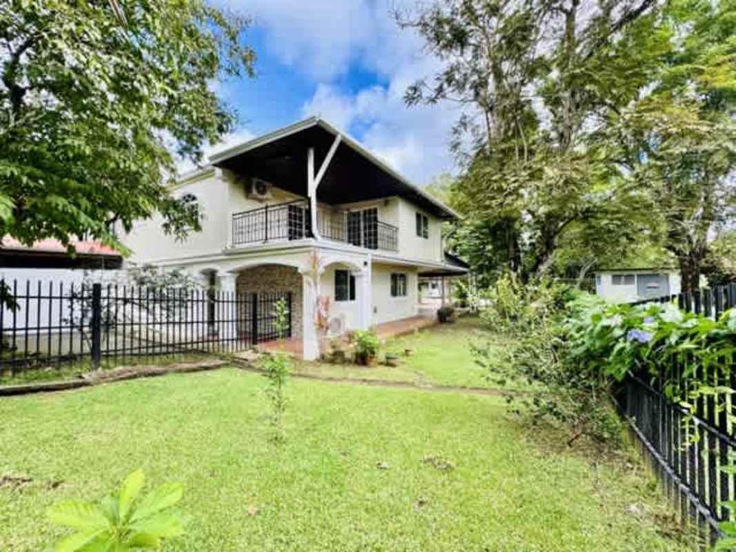 House patio with private swimming pool lush garden in Residencial Cardenas Panama