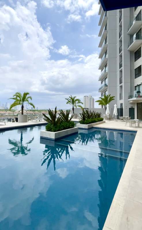Infinity rooftop swimming pool with city skyline view in Ocean House Santa Maria Panama City