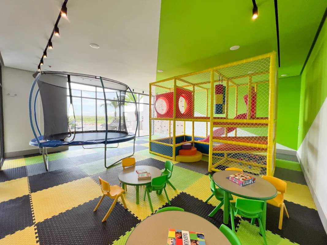 Colorful indoor kids playroom with trampoline and play structures Ocean House Santa Maria Panama City