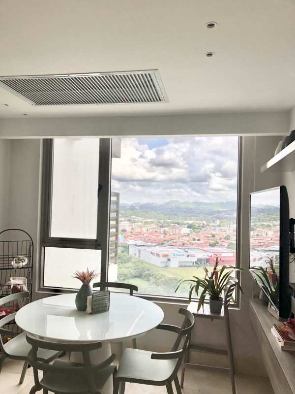 Modern elegant dining area with large windows and city views in Santa Maria Panama apartment