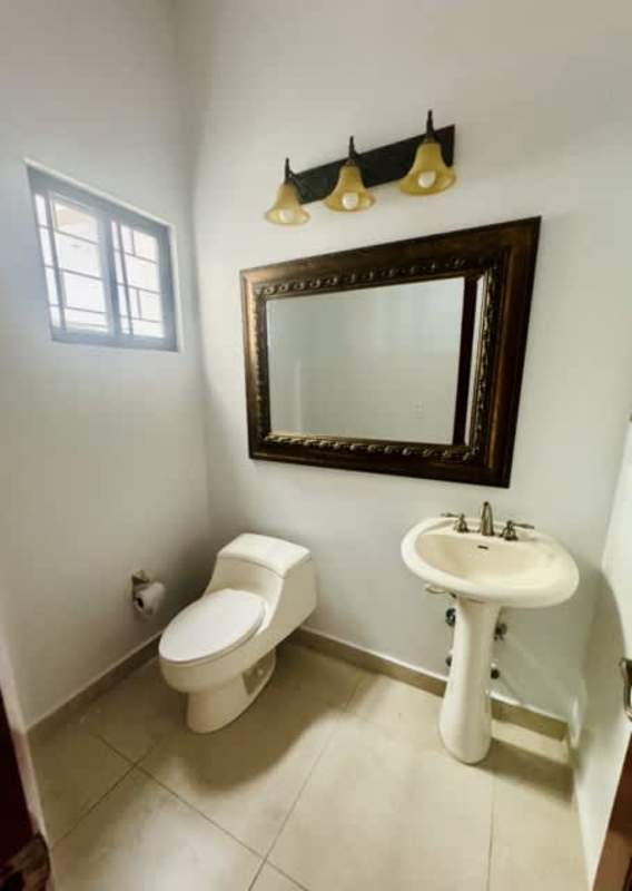 Large covered terrace with ceiling fans, garden views in Cardenas Clayton family house Panama rental