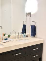 Minimalist bathroom large mirror white vanity in loft at Puntarenas Buenaventura Panama