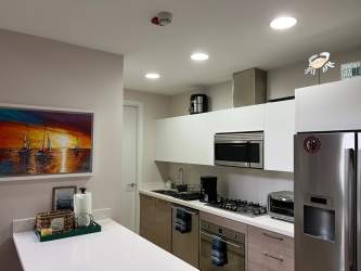 White cabinets stainless appliances modern kitchen Puntarenas Buenaventura